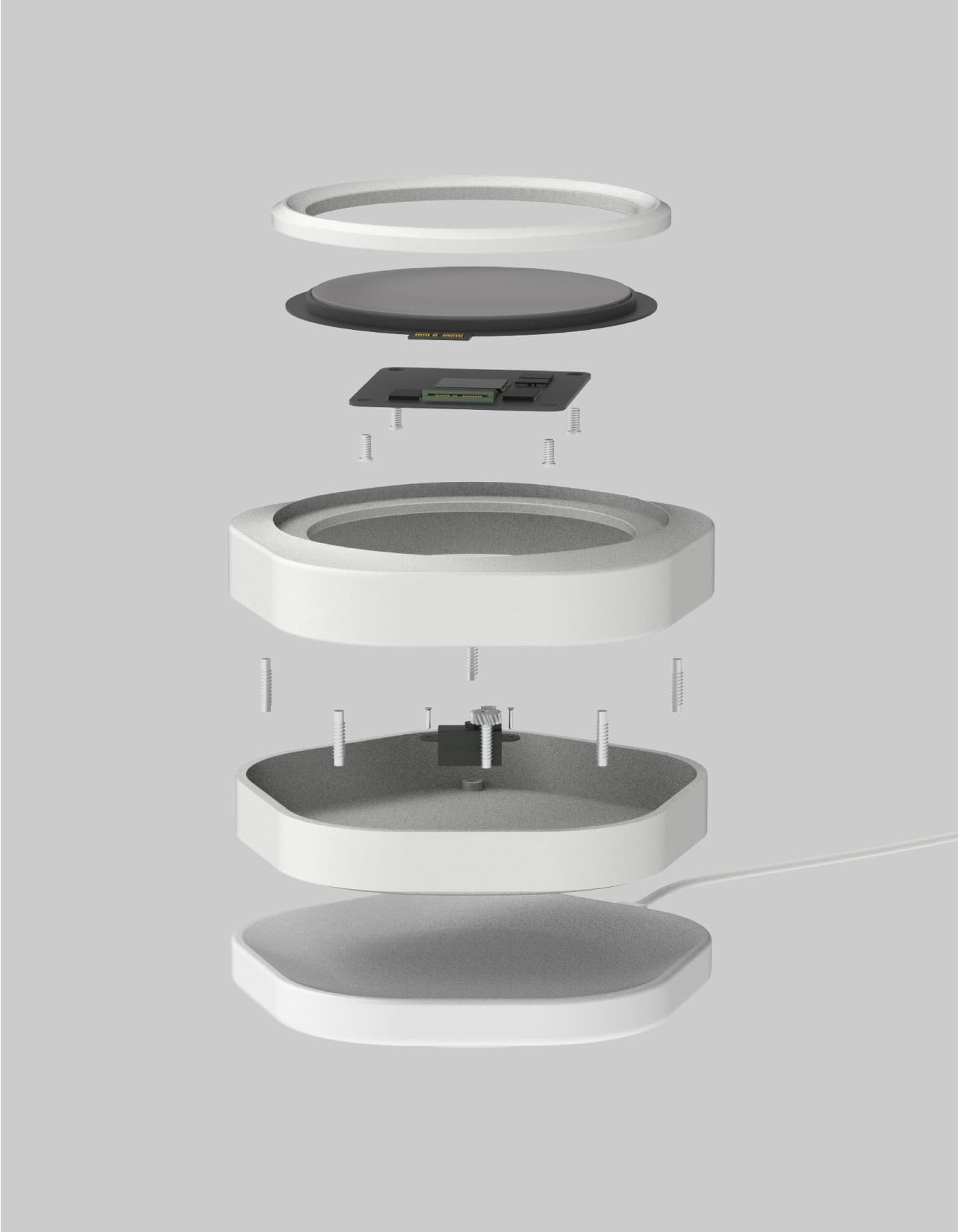 Exploded view of Budgetty. From top to bottom: input dial, circular screen, motherboard, motherboard screws, top cover, cover screws, bottom cover, and the wireless charger.